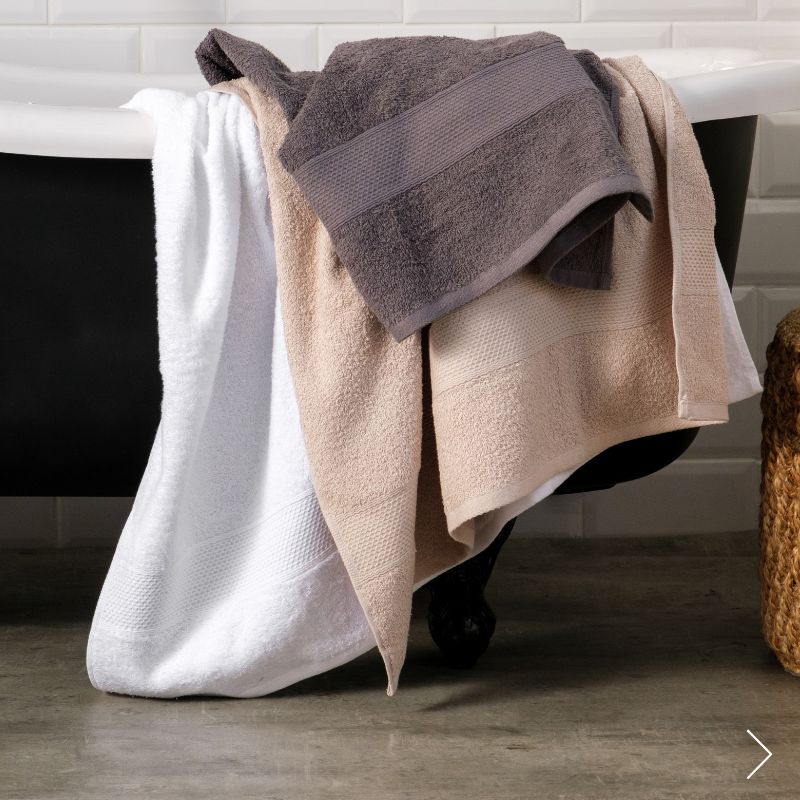 Bath towels in white, charcoal and beige
